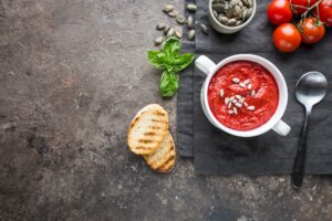 Tomato soup in a white bowl